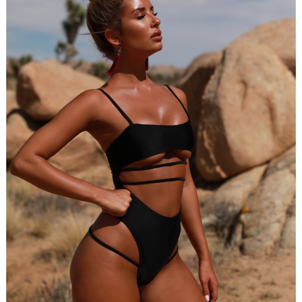 Oh prolly “submission strappy” thong swimsuit